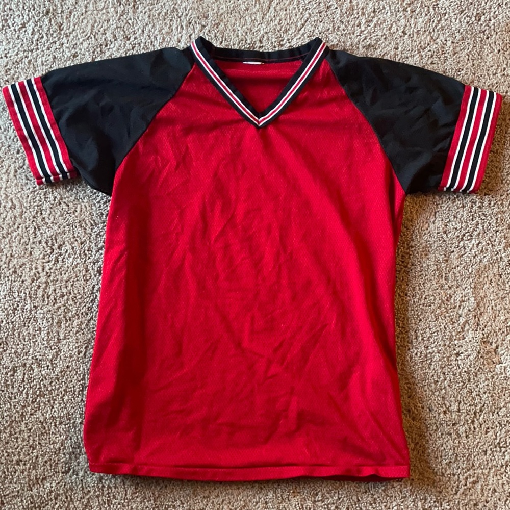 Red penny material jersey shirt.